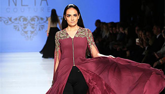 Models present creations at Toronto Fashion Week