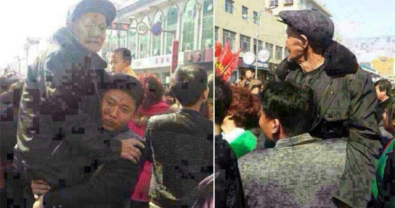 陕西：男子抱着父亲看秧歌