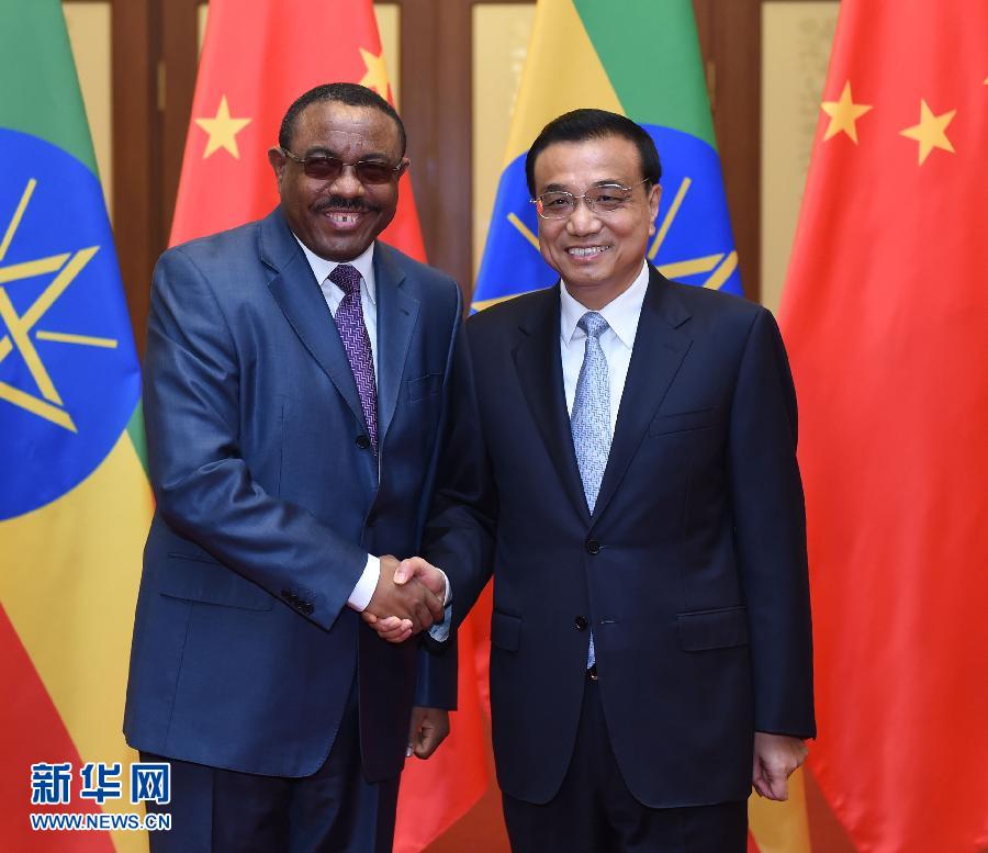 9月4日，国务院总理李克强在北京人民大会堂会见来华出席中国人民抗日战争暨世界反法西斯战争胜利70周年纪念活动的埃塞俄比亚总理海尔马里亚姆。新华社记者 张铎 摄