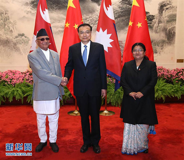 3月21日，國務院總理李克強在北京人民大會堂同來華進行正式訪問並將出席博鰲亞洲論壇2016年年會的尼泊爾總理奧利舉行會談。 新華社記者龐興雷 攝