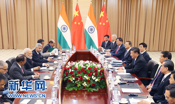6月9日，国家主席习近平在阿斯塔纳会见印度总理莫迪。 新华社记者姚大伟 摄