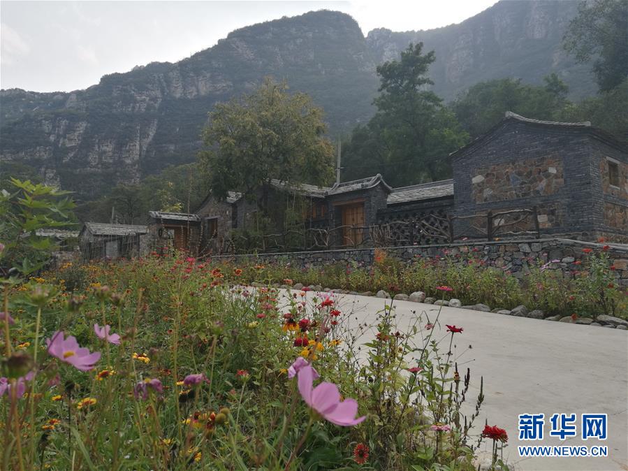 (在习近平新时代中国特色社会主义思想指引下——新时代新作为新篇章·乡村振兴战略·图文互动)(3)从“破破岭”到“绿金山”——北京房山黄山店村的绿色变身记