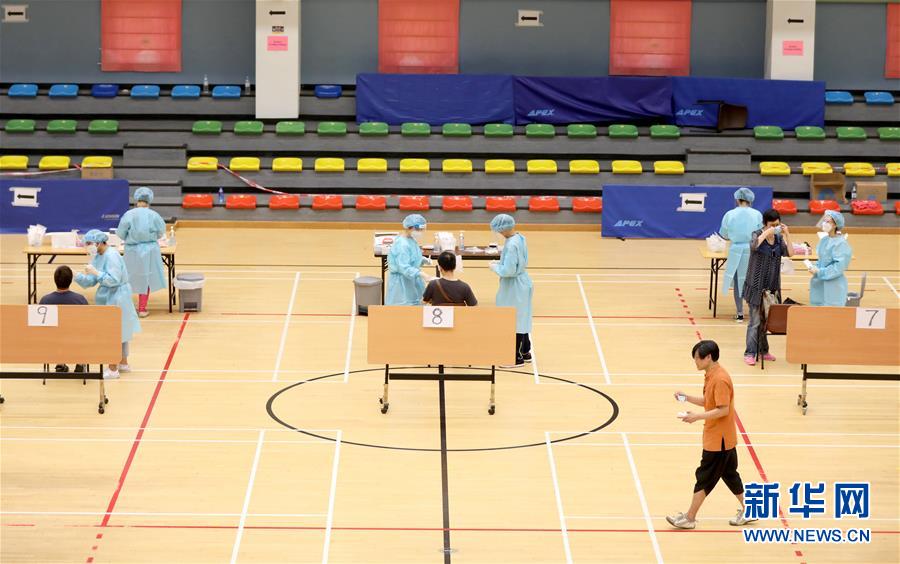 (图文互动)(4)“身为医护人员一分子,应该出来帮忙”——参与新冠病毒社区检测的香港医护人员速写