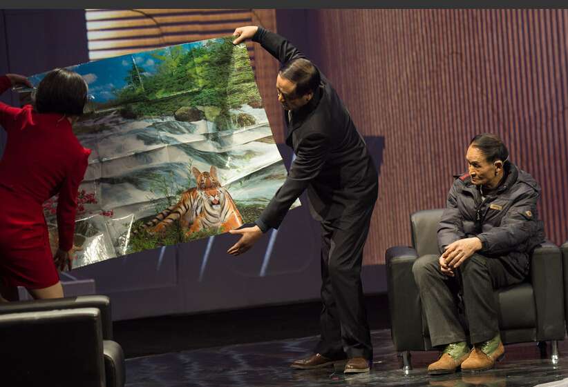 周正龙携新&ldquo;虎照&rdquo;赴京申述 最高法受理