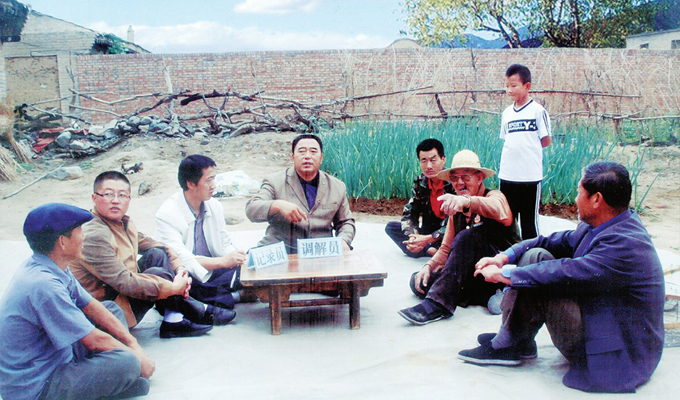 调解“家长里短,鸡毛蒜皮”的小事情是李培斌从事的大事业