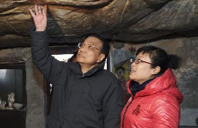 李克强在棚户区召开现场会