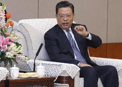 赵乐际会见新加坡常秘访华团