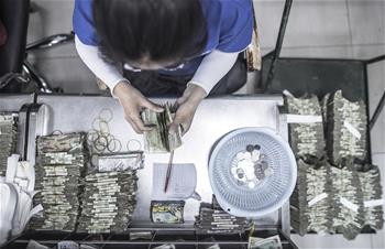 &ldquo;無現金&rdquo;進程中的公交點鈔員