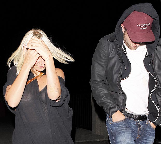 Sia Furler shows off her breasts throughher top on outing with Robert Pattinson