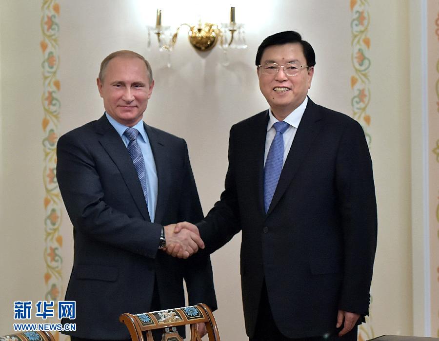  6月9日，全国人大常委会委员长张德江在莫斯科会见俄罗斯总统普京。新华社记者李涛摄 