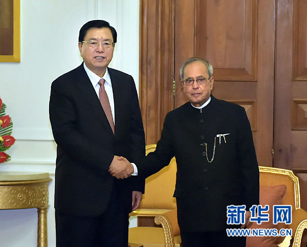 6月15日，全国人大常委会委员长张德江在新德里会见印度总统慕克吉。新华社记者 李涛 摄