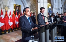 李克强与加拿大总理共同会见记者