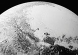NASA公布冥王星新照 巨大冰原被陨石坑环绕（组图）