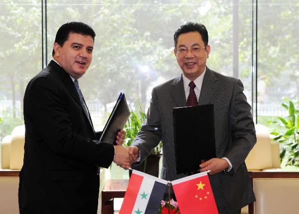 周锡生会见叙利亚通讯社社长