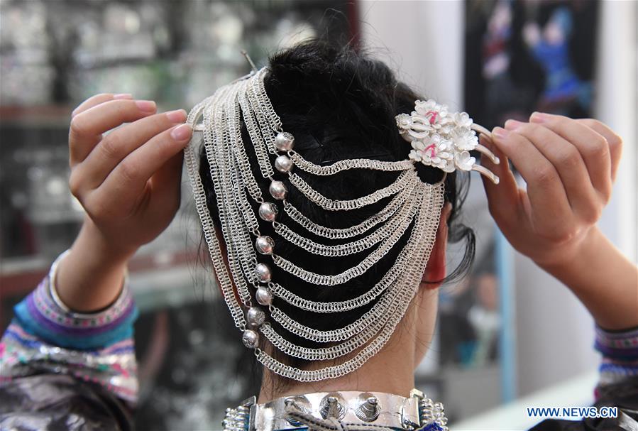 Women of Miao ethnic group wear fancy silver ornaments for decoration -  Xinhua | English.news.cn