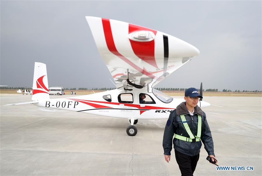 China's first four-seater electric aircraft makes maiden flight ile ilgili görsel sonucu