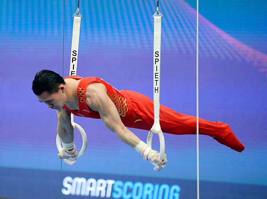 top chinese gymnasts work on individual movements in winter