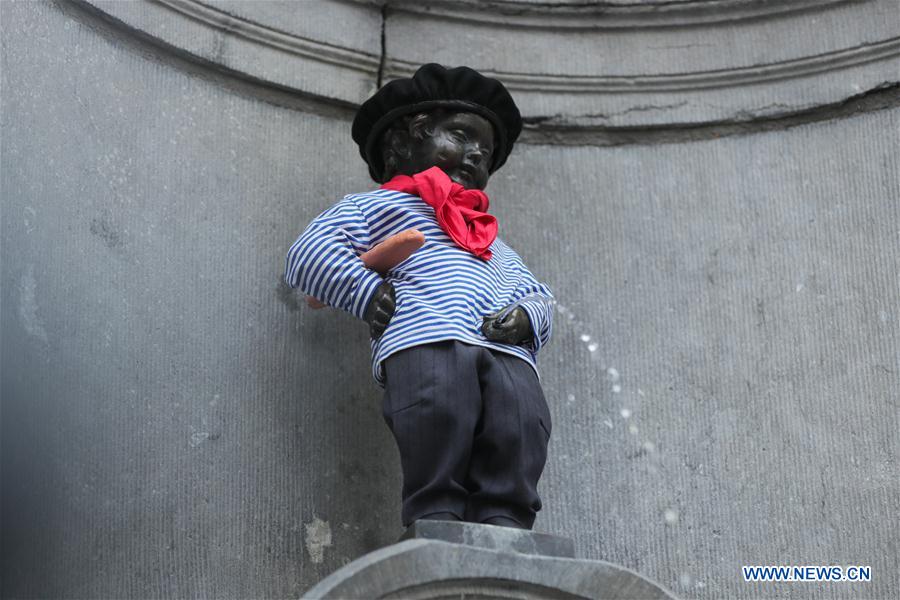 Manneken-Pis dressed up to commemorate French national day in Brussels ...