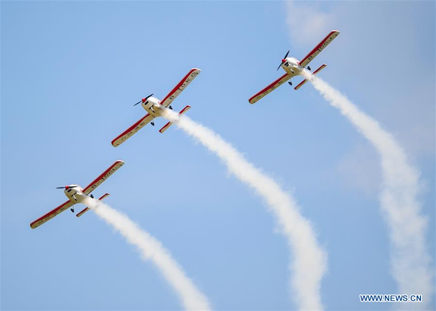 planes fly in formation during an aerobatics show in siziwang