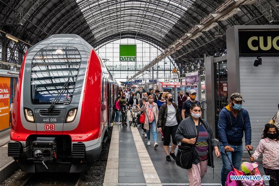 people wear face masks at main train station in frankfurt