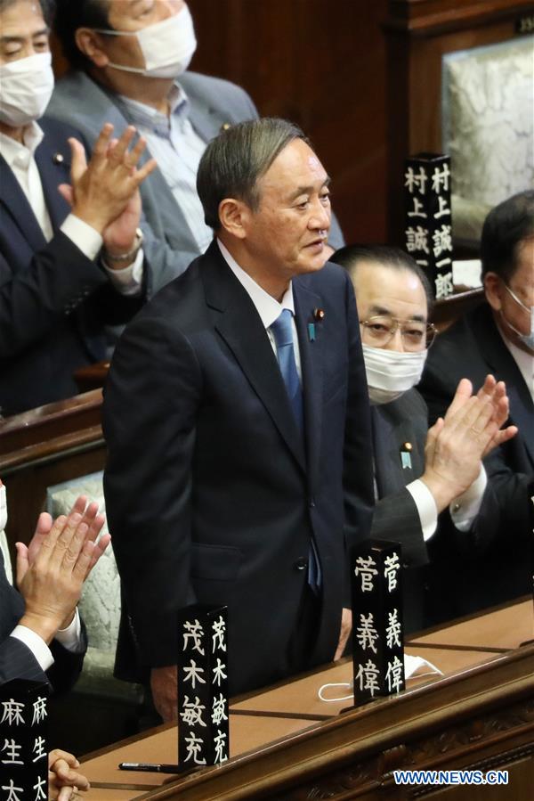 yoshihide suga elected as japans new prime minister to succeed