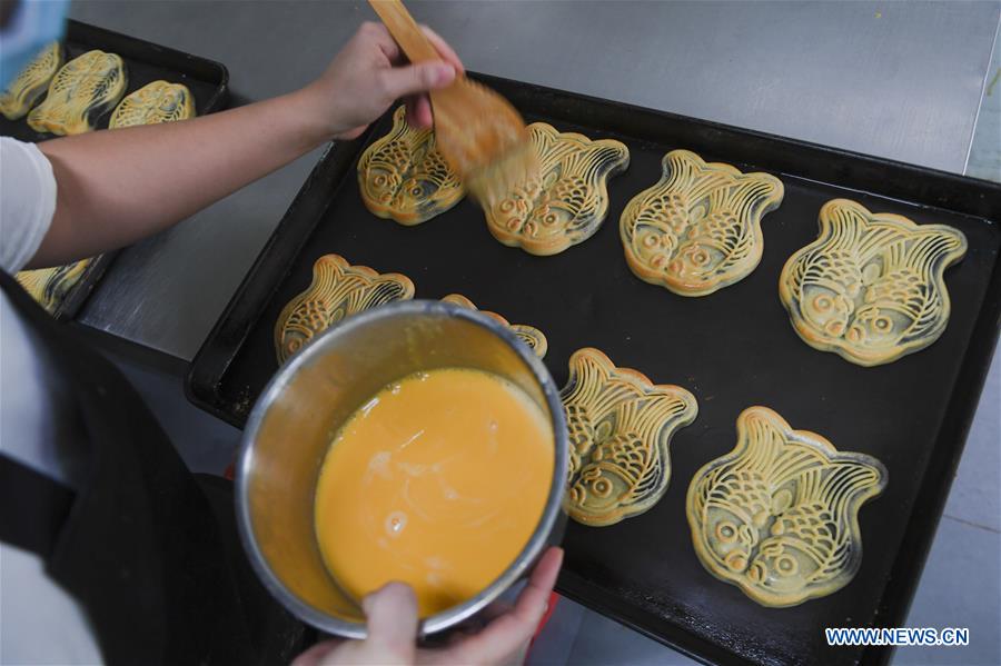 Food companies busy producing moon cakes ahead of MidAutumn Festival
