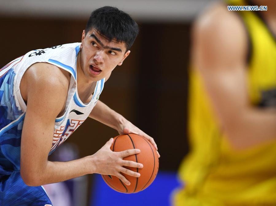 lutpulla (l) of xingjiang flying tigers competes during the 30th