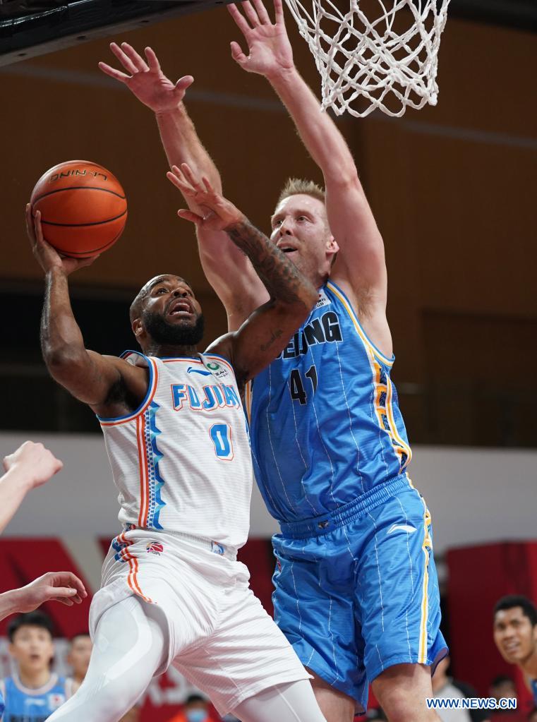 robert golden (l) of fujian sturgeons goes to the basket past