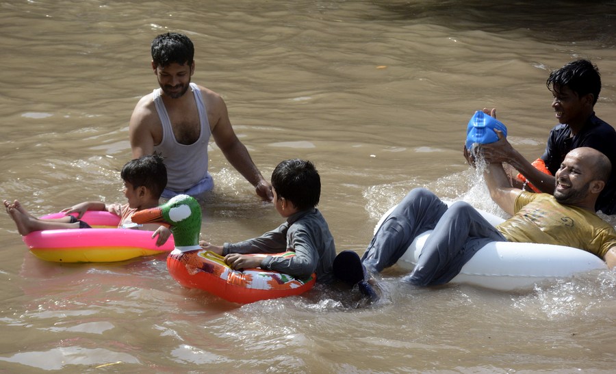 themselves in canal as temperature reaches 38 degrees celsius