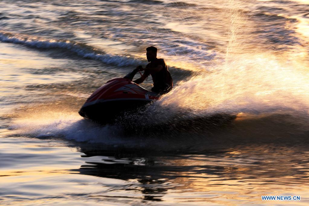 iraqi youth enjoys jet-skiing on tigris river