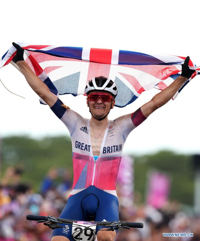 thomas pidcock of britain celebrates winning the mens cycling
