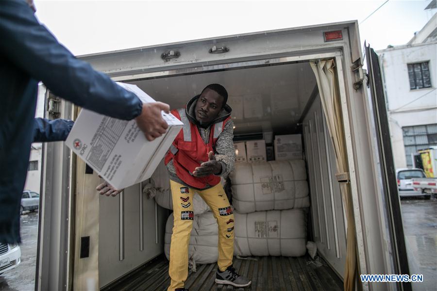 libyan red crescent workers transfer intl red cross aid in