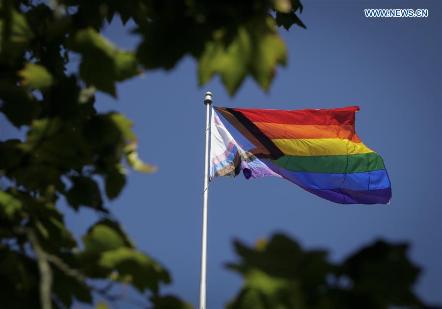 a pride flag raising ceremony was held outside vancouver ciyy