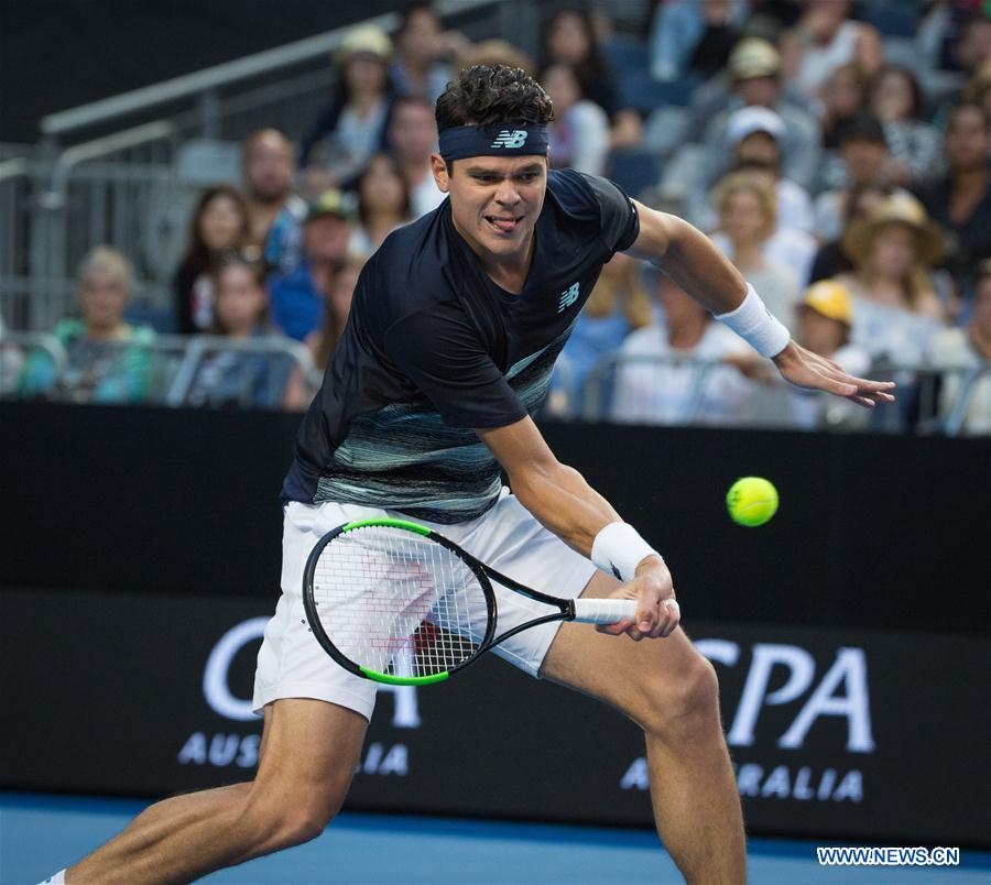 milos raonic of canada returns the ball during the mens singles