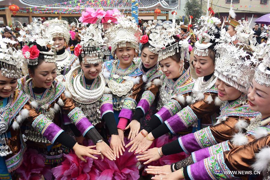 people of miao ethnic group dance to celebrate spring festival
