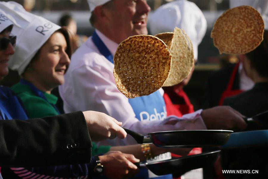 for photographers ahead of the rehab parliamentary pancake race