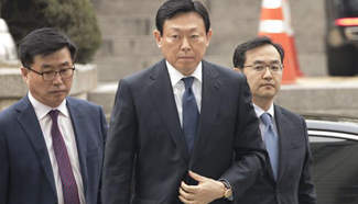 Lotte Group Chairman arrives to attend trial at Seoul Central District Court