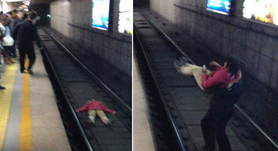 北京一女子地铁卧轨被强行抱出