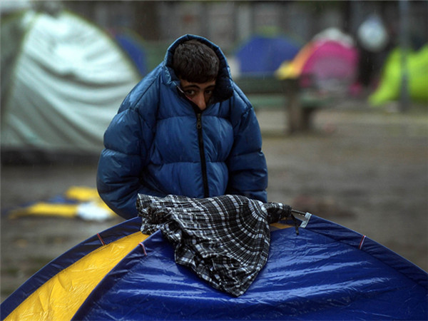 消极应对难民问题美国受国际国内各方批评