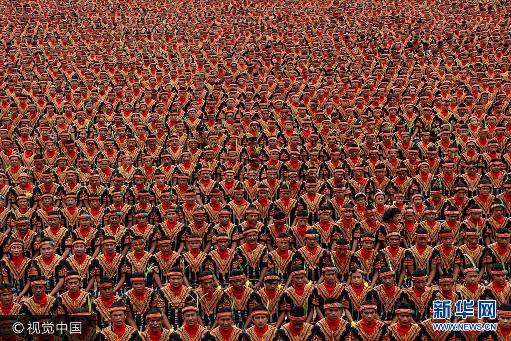 ***_***ACEH, INDONESIA - AUGUST 12: 10.447 male dancers perform the Saman dance, one of Aceh's traditional dance at Gayo Lues, Aceh Province, Indonesia on August 12, 2017. Saman dance is a Gayo tribe dance used to convey messages of kindness and since 2011 registered in Unesco as world heritage. (Photo by Junaidi Hanafiah/Anadolu Agency/Getty Images)