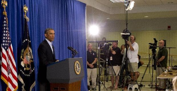 奥巴马说将继续采取行动保护美国人(组图)